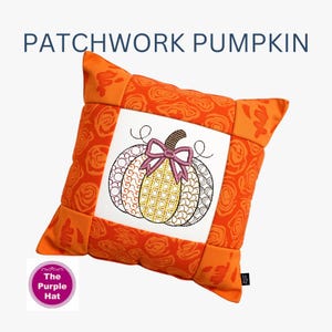 May include: Square orange pillow with a patchwork pumpkin design. The pumpkin is embroidered with brown, gold, and white sections, a pink bow, and a brown stem. The pillow has a white center and orange floral patterned edges. Text on the pillow reads "PATCHWORK PUMPKIN".