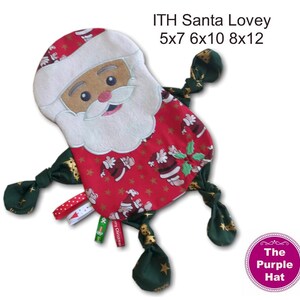 May include: A red and green Santa Claus lovey with a white beard and a black face. The lovey has four green and gold knotted arms. The lovey is available in sizes 5x7, 6x10, 8x12. The text "ITH Santa Lovey" and "The Purple Hat" are visible in the image.