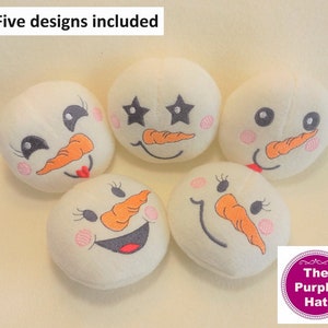 May include: Five white felt snowman ornaments with different embroidered facial expressions. The ornaments include a snowman with stars, a snowman with a smile, a snowman with a frown, a snowman with a wink, and a snowman with a surprised expression. The text "Five designs included" is at the top of the image.