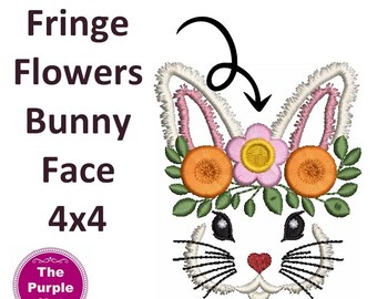 May include: An embroidery design of a bunny face with fringe-textured ears, adorned with a crown of pink and orange flowers and green leaves. The text reads: Fringe Flowers Bunny Face 4x4. A circular logo includes the text: The Purple Hat.