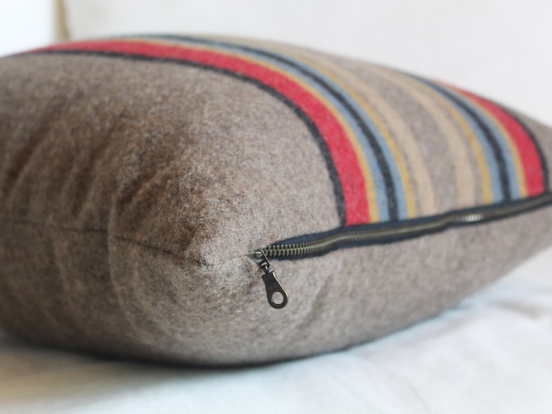 Yakima Camp Stripe Merino Wool Pillow Cover in Mineral Umber by True Having • Shown in 18"x18" size, close-up image of zipper
