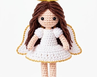 May include: A handmade crochet doll shaped like an angel with long brown yarn hair, a white dress with short sleeves, and a gold-colored halo. The doll features two white wings with gold-colored trim on the back and small black bead eyes.