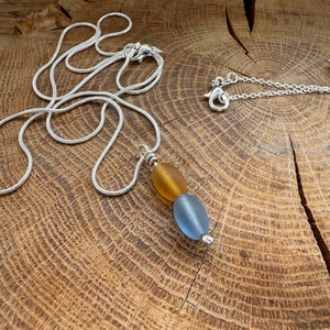 seabead silver necklace. Choose red single. yellow blue double. seaglass necklace. spinner image 3