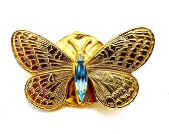 Broche de pedrería con pasador de mariposa dorado de Philippe Ferrandis de la década de 1990
