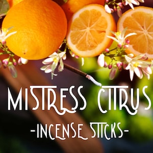 May include: A close-up of a smoldering incense stick with a white tip, with a background of orange citrus fruit and white blossoms. The text "MISTRESS CITRUS - INCENSE STICKS -" is displayed below the incense stick.