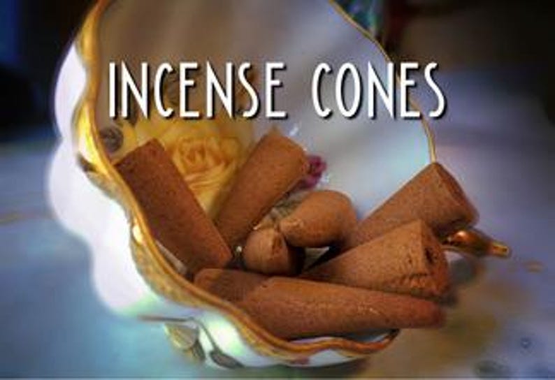 A bowl filled with brown incense cones sits on a table, with the text "INCIENSE CONES" displayed above it.