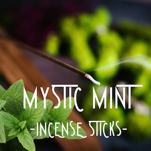 May include: A close-up of a smoldering incense stick with a white tip, labeled "Mystic Mint - Incense Sticks -" against a backdrop of green foliage.