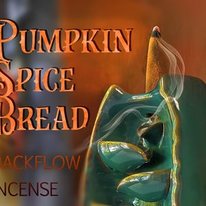 May include: A dark green ceramic backflow incense burner with a glossy finish, featuring a lit cone incense emitting white smoke. The text PUMPKIN SPICE BREAD BACKFLOW INCENSE is displayed in orange lettering on the left side of the image.