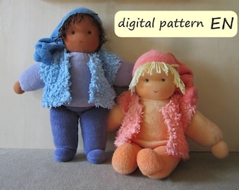 May include: Two handmade dolls wearing blue and pink fuzzy jackets. The doll on the left is wearing a blue hat and the doll on the right is wearing a pink hat. The dolls are sitting on a light brown surface. The text "digital pattern EN" is in a yellow box above the dolls.