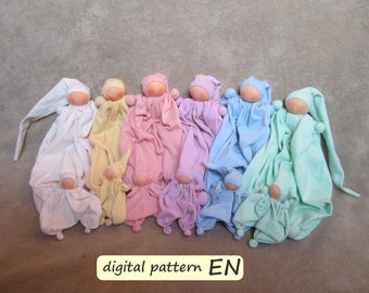May include: A set of ten handmade fabric dolls in various pastel colors, including white, yellow, pink, light blue, and green. Each doll has a simple, rounded face and a small, pointed hat. The dolls are arranged in a row, with the largest doll at the left and the smallest doll at the right. The dolls are all wearing simple, loose-fitting clothing. The text "digital pattern EN" is visible at the bottom of the image.