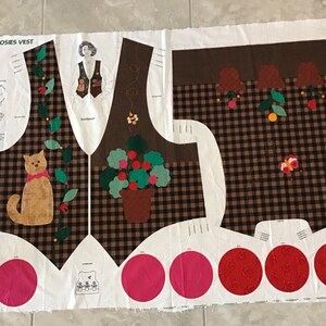 May include: A fabric panel for a quilting project featuring a brown and white plaid pattern with a cat, a potted plant, and a butterfly. The panel includes instructions for a "Pot Full of Posies Vest".