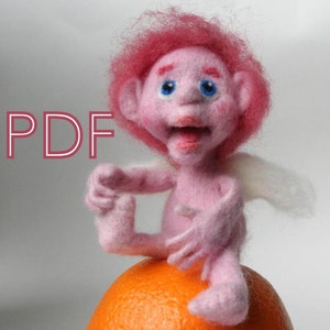 May include: A pink felt doll with a white felt wing, blue eyes, and pink hair. The doll is sitting on an orange fruit.