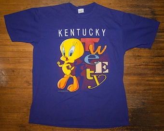 Vintage 90s Tweety Bird T Shirt Looney Tunes Spell Out Kentucky Pop Culture Purple Velva Sheen Made In USA Cartoon EUC Large M/L