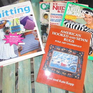 May include: A collection of four craft books, including "Now You're Knitting", "McCall's Needlework & Crafts", "American Hooked and Sewn Rugs", and "101 Patterns to Crochet You Give".