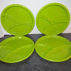 May include: Four bright green divided plates. Each plate has three sections.