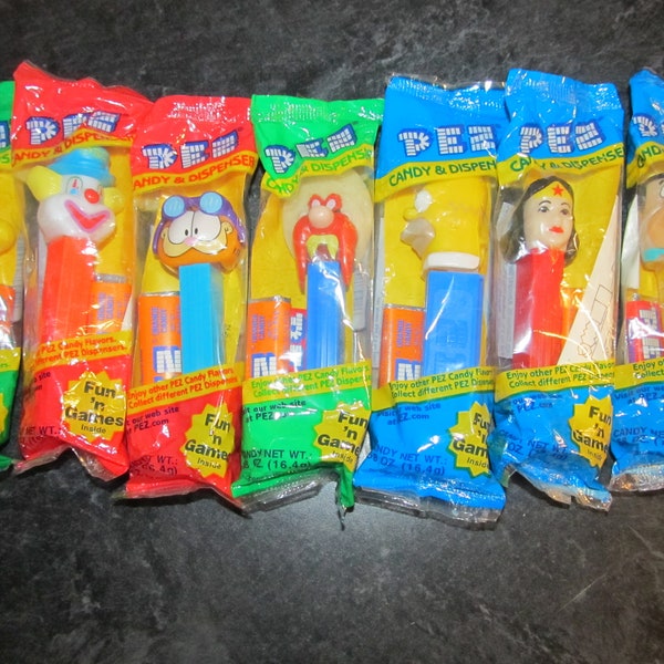 Sealed Pez Candy Dispensers / Party Favors / Choice /Woodstock /Clown /Garfield /Yosemite Sam/ Homer Simpson/ Wonder Woman/Fred Flintstone