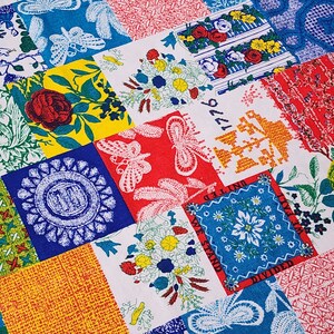 May include: A colorful patchwork fabric with various patterns, including floral designs, geometric shapes, and stylized butterflies. The fabric features a mix of red, blue, yellow, and white colors.