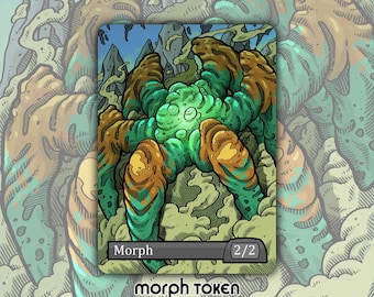 May include: A fantasy art card featuring a green and brown creature with a textured appearance. The card has the word "Morph" and "2/2" on it. The words "morph token" are at the bottom of the card.
