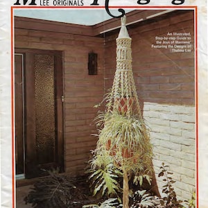 May include: A vintage book cover featuring a macrame hanging plant holder with a plant inside. The cover is titled "Macra-Hangings Lee Originals" and includes the text "An Illustrated, Step-by-step Guide to the Joys of Macrame Featuring the Designs of Thelma Lee".