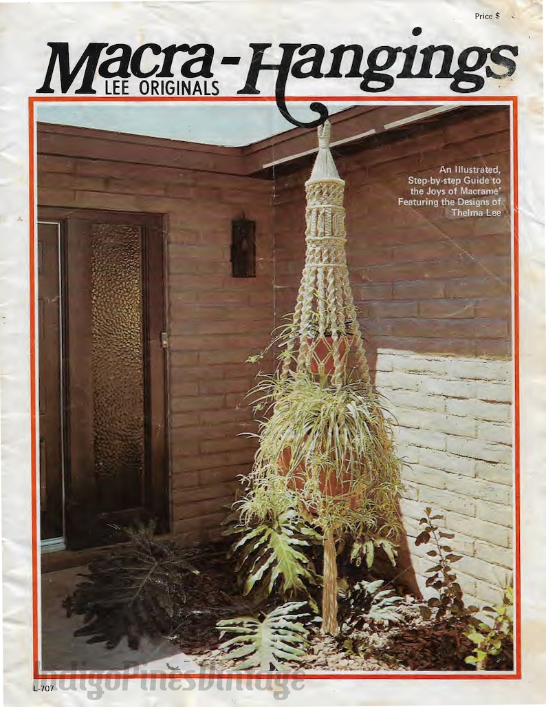May include: A vintage book cover featuring a macrame hanging plant holder with a plant inside. The cover is titled "Macra-Hangings Lee Originals" and includes the text "An Illustrated, Step-by-step Guide to the Joys of Macrame Featuring the Designs of Thelma Lee".