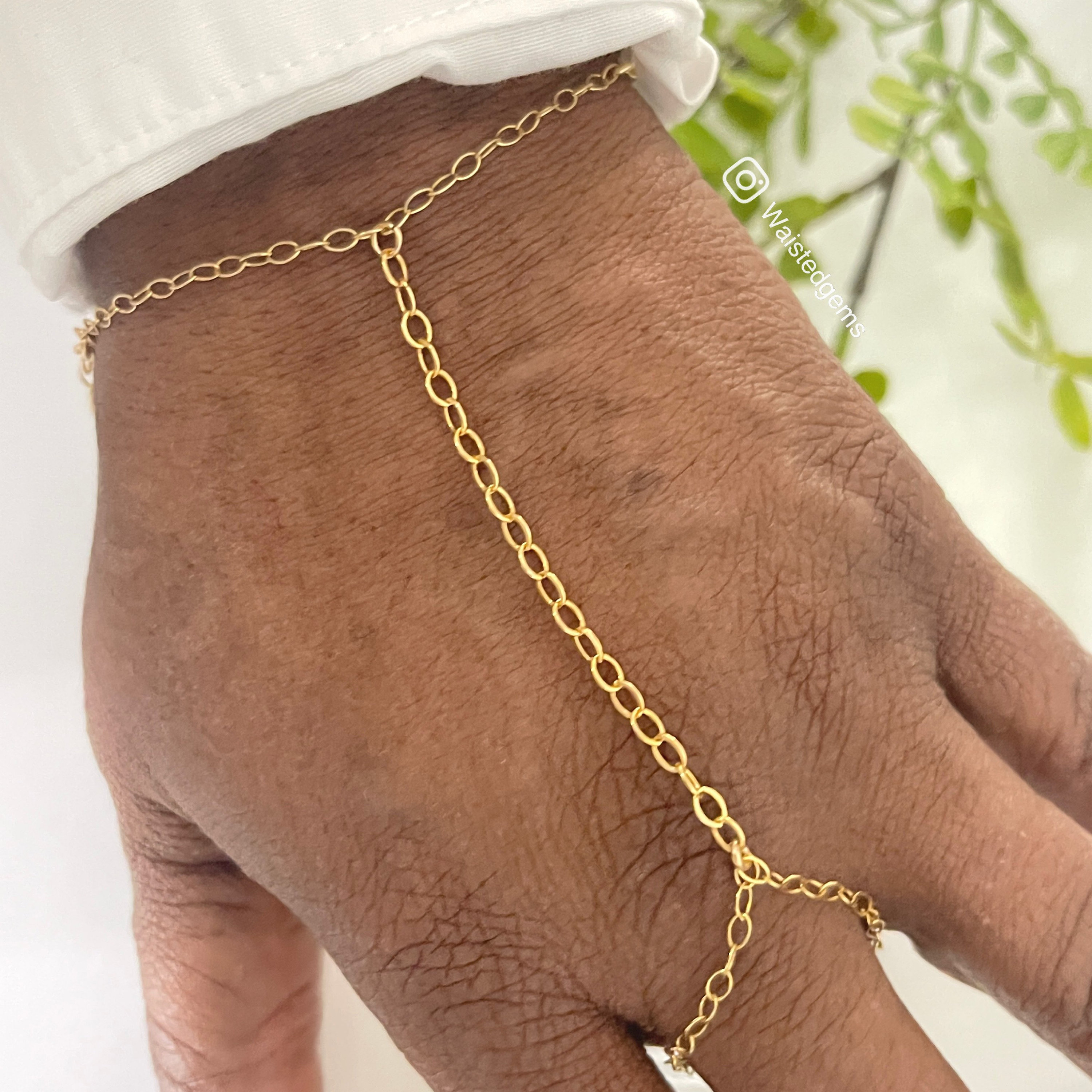 Gold hand on sale bracelet with ring
