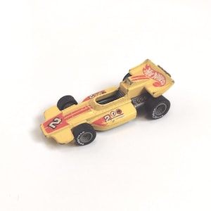 Vintage Hot Wheels Toy Car #4372 Lightning Gold from the Real Riders Series | Die Cast Formula 1 Metallic Yellow Racecar Gift for Collectors