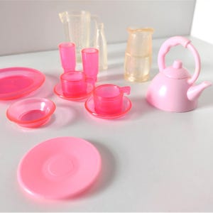 May include: A set of three ceramic mugs with a speckled, matte finish. The mugs are in shades of cream, light gray, and dark gray. Each mug has a simple, minimalist design, perfect for coffee or tea.