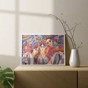 May include: A framed print of a colourful abstract painting featuring three women with floral headbands. The women are depicted in a stylised, geometric style with vibrant colours and patterns.