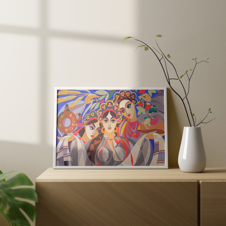 May include: A framed print of a colourful abstract painting featuring three women with floral headbands. The women are depicted in a stylised, geometric style with vibrant colours and patterns.