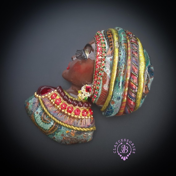 African woman brooch