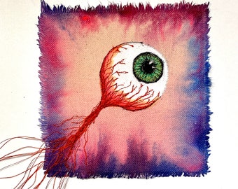 Small eyeball emboidered artwork