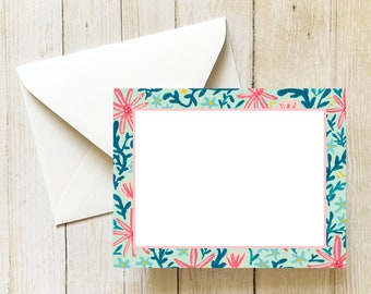 May include: A blank card with a floral border. The border features pink flowers, blue leaves, and a light blue background.