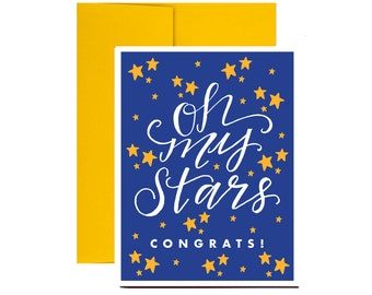 May include: A blue card with gold stars and the text "Oh my stars! Congrats!" in white lettering.