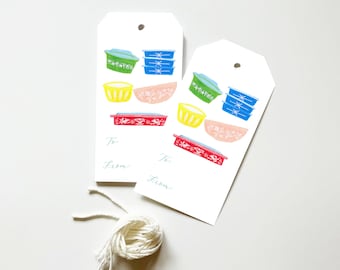 May include: Two white gift tags with a blue, green, yellow, and red illustration of vintage kitchenware. The tags have the words "To:" and "From:" printed on them.