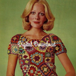 May include: A crochet top with a colorful granny square pattern. The top has short sleeves and a scalloped neckline. The top is made with a variety of colors, including red, orange, yellow, green, blue, purple, and pink.