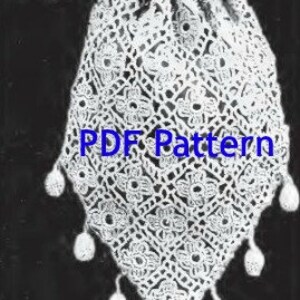 May include: White crocheted drawstring bag with a long strap and tassel accents. The bag is made with a delicate lace pattern and has a "PDF Pattern" label.