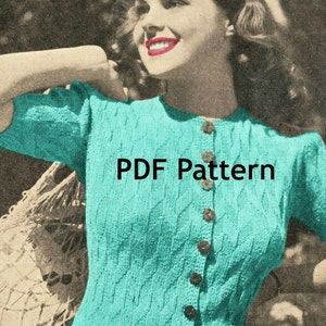 May include: A vintage knitting pattern for a teal blue cardigan with a cable knit design and button closure. The pattern is titled "PDF Pattern".