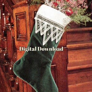 May include: A green velvet Christmas stocking with white lace trim. The stocking is hanging on a wooden banister.