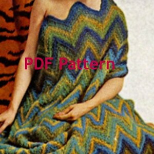 May include: A crochet pattern for a colorful chevron-patterned shawl or blanket. The pattern is available as a PDF download. The image shows a woman wearing the finished shawl.