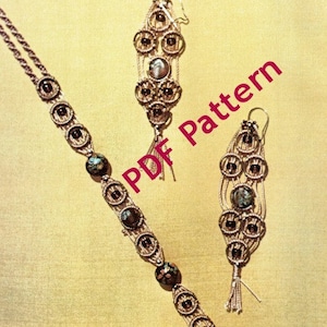 May include: A set of jewelry featuring a necklace and earrings made with brown cord and dark brown beads. The necklace and earrings have a tassel detail. The image includes the text "PDF Pattern".