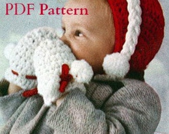May include: A red and white crocheted Santa hat with a white pom-pom on top. The hat is being worn by a baby holding a white crocheted airplane toy.