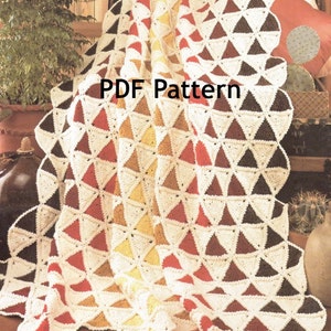 May include: Crochet pattern for a blanket with a geometric design of triangles in shades of brown, red, and yellow. The pattern is called "PDF Pattern".