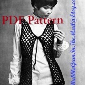 May include: A black crochet vest with a tie closure. The vest has a loose, open weave and a V-neck.