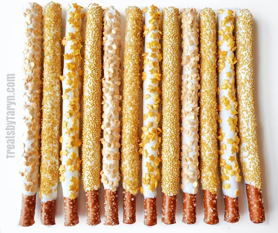 Chocolate Covered Pretzels. Gold pretzels. Gold and white pretzels. baby spritz pretzel rods. Gold and white rods. Gold pretzels. Gold treat