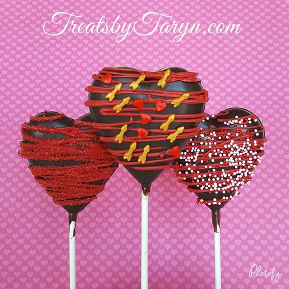 Valentine heart lollipops. heart lollipops. valentine's day treats. valentine's lollipops. kids treats. chocolate. chocolate lollipops.