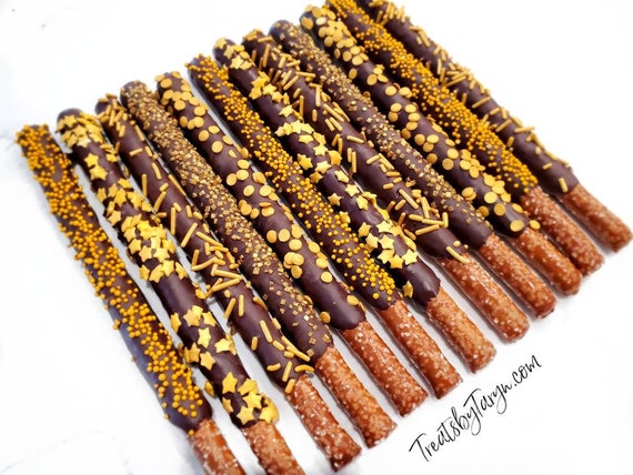 Chocolate Covered Pretzels. Gold pretzels. Gold and white pretzels. baby spritz pretzel rods. Gold and white rods. Gold pretzels. Gold treat