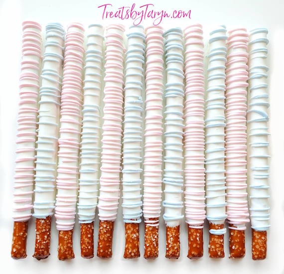 Chocolate Covered Pretzels. baby blue and white pretzels. Gender reveal pretzels. baby spritz pretzel rods. baby blue and pink rods