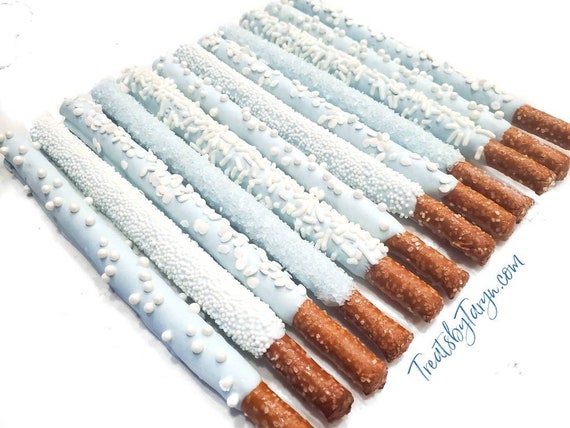 Chocolate Covered Pretzels. baby blue pretzels. winter wonderland pretzels. baby spritz pretzel rods. baby blue and white rods