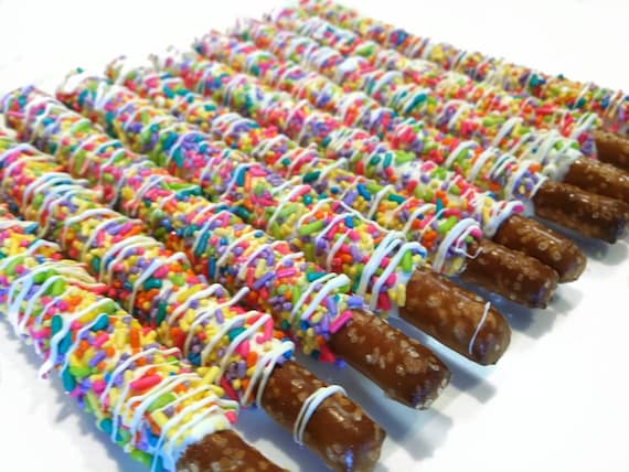 Rainbow Chocolate Covered Pretzels. rainbow chocolate dipped pretzels. rainbow pretzels. unicorn pretzels. rainbow party favors. pretzels