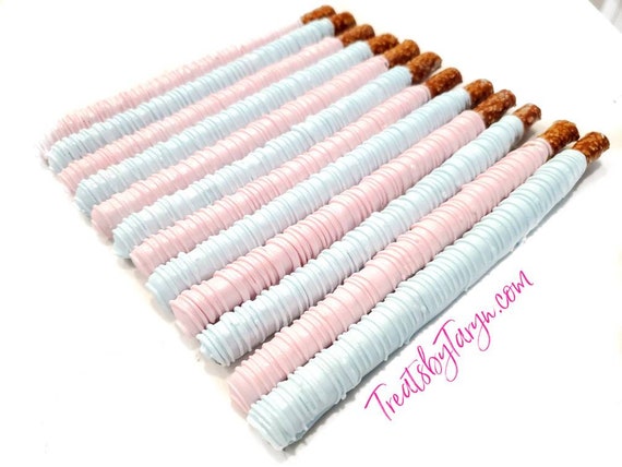 Chocolate Covered Pretzels. baby blue and white pretzels. Gender reveal pretzels. baby spritz pretzel rods. baby blue and pink rods